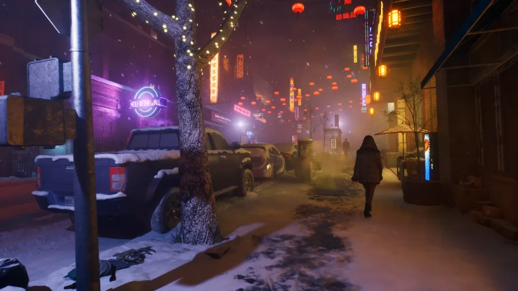 A nighttime scene in a neon-lit Chinatown street in snowy winter. Trucks and cars are parked close to the viewer's position on the roadside, and a couple of figures can be seen walking away. A nearby leafless tree is strung with fairy lights, and many colorful lanterns cross over the road up ahead.